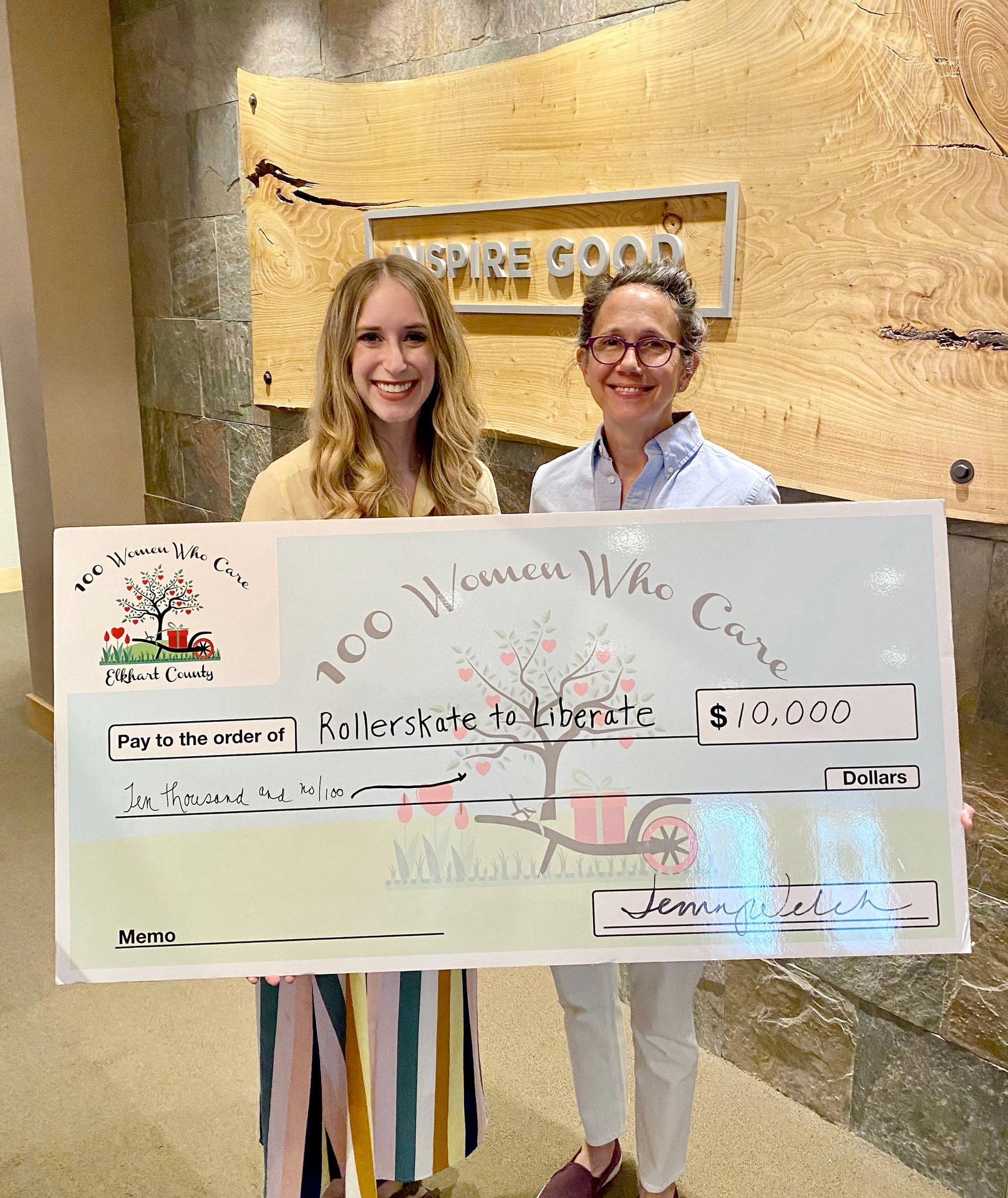 Sarah Virgil and Jenny Welch with Check Presentation to Rollerskate to Liberate