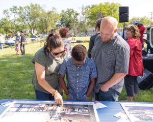 Community members look at plans for the new Tolson Center.